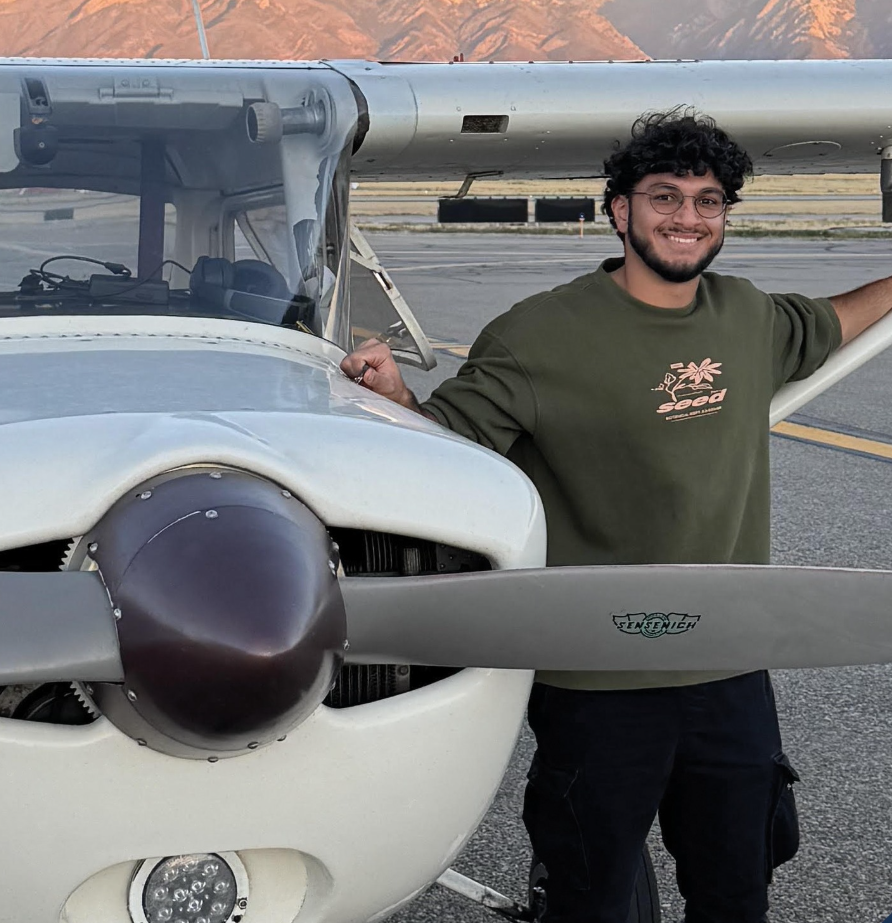 Aerotech student standing in front of a Cessna